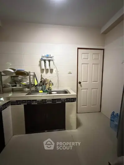 Cozy kitchen with modern sink and water filtration system