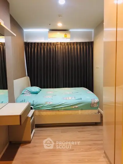 Cozy bedroom with modern decor and ample natural light