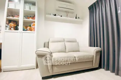 Cozy living room with plush sofa and modern decor