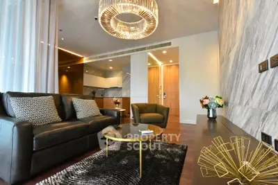 Luxurious modern living room with elegant chandelier and stylish decor