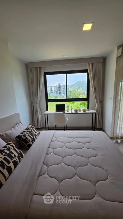 Modern bedroom with scenic view and stylish decor