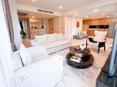 Luxurious open-plan living room with elegant decor and spacious seating area.