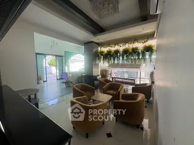Stylish modern lounge area with plush seating and natural light, perfect for relaxation and social gatherings.