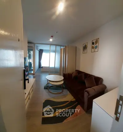 Spacious living room with modern decor and cozy seating area