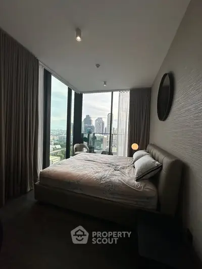 Luxurious bedroom with stunning city view and modern decor