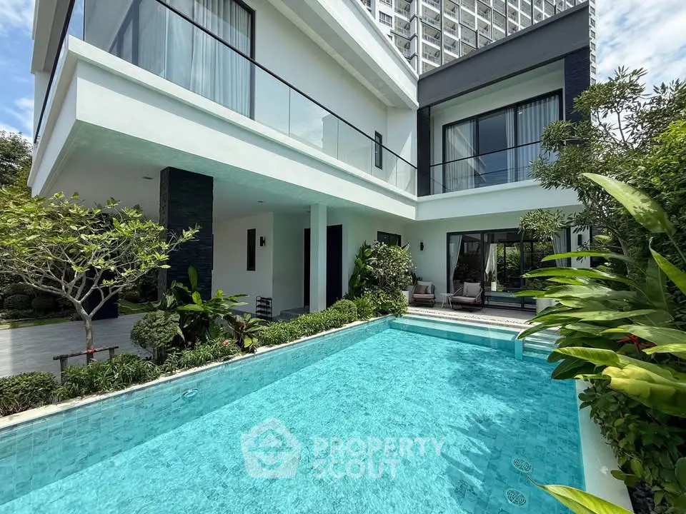 Luxurious modern villa with private pool and lush garden, perfect for relaxation and entertaining.