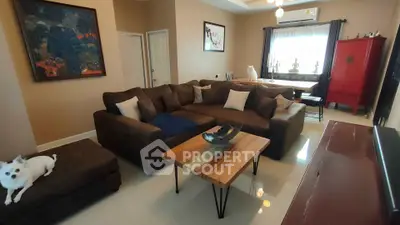 Spacious living room with modern decor and cozy seating area