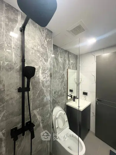 Modern bathroom with sleek shower and elegant marble walls