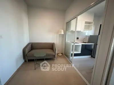 Modern apartment with cozy living area and sleek kitchen design