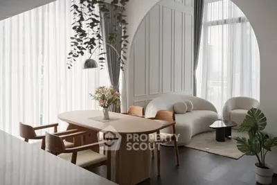 Elegant modern living room with stylish furniture and large windows for natural light