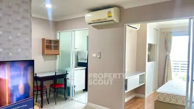 Cozy apartment interior with air conditioning, dining area, and bedroom view.