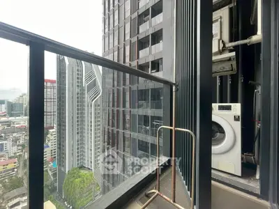Modern high-rise balcony with city view and washing machine