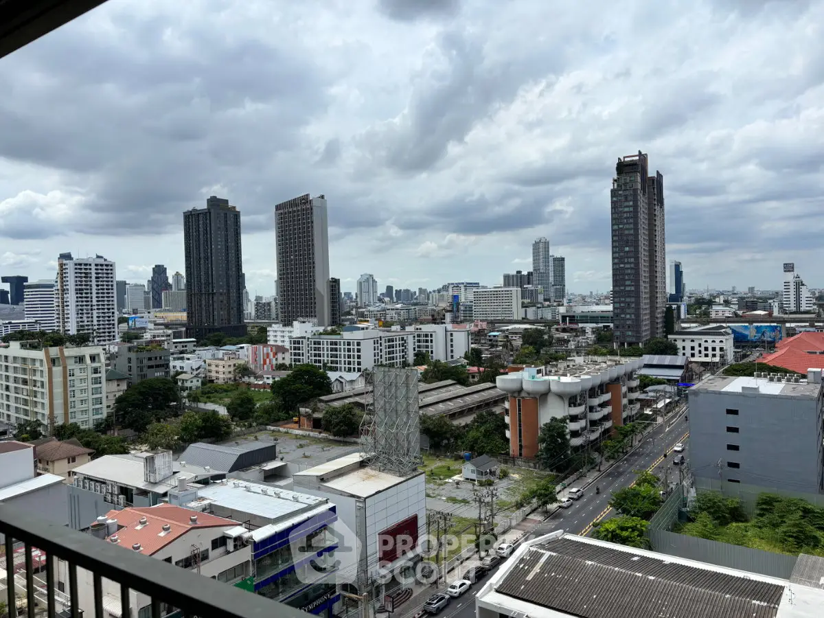 Stunning cityscape view from a high-rise balcony showcasing urban skyline and modern architecture.