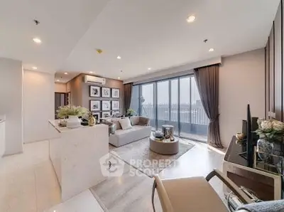Luxurious living room with modern decor and stunning city view from large windows.