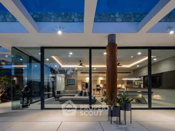 Stunning modern home with glass walls and open living space, perfect for luxury living.