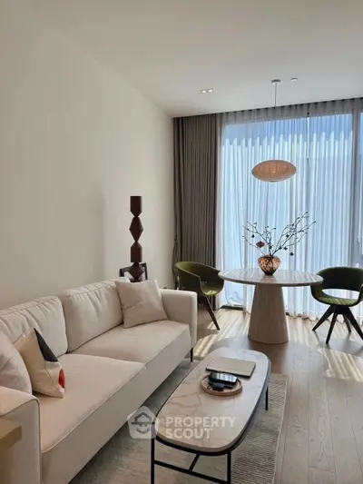 Elegant living room with modern decor and natural light