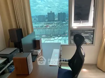 Modern study room with city view, ergonomic chair, and sleek desk setup.