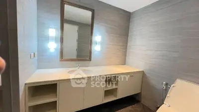 Modern bathroom with sleek vanity and ambient lighting