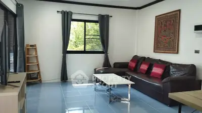 Cozy living room with leather sofa and modern decor