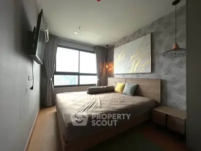 Modern bedroom with large window and stylish decor in a high-rise apartment.