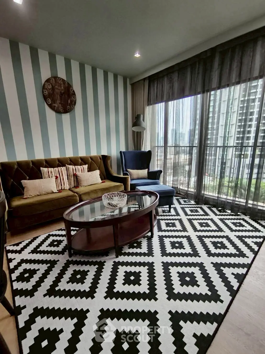 Stylish living room with modern decor and city view, featuring a cozy sofa and elegant coffee table.