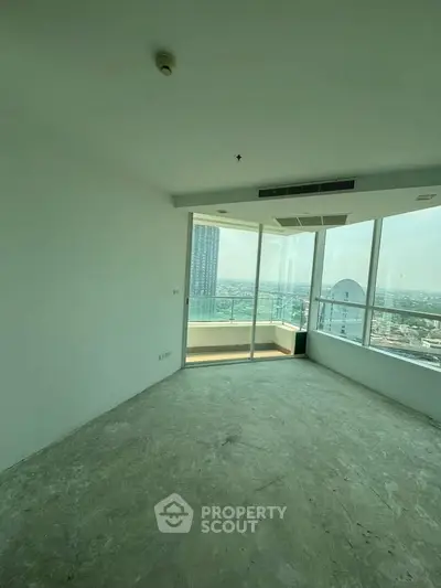 Spacious corner unit with floor-to-ceiling windows offering panoramic city views.