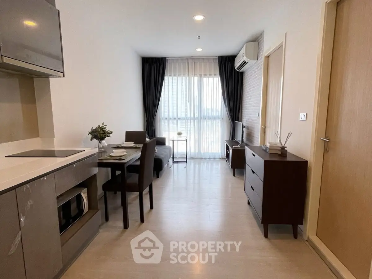 Modern open-plan living room with kitchen in stylish apartment