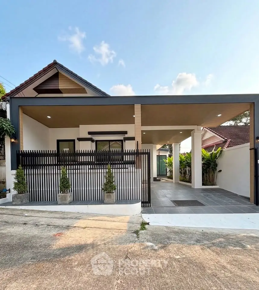 Charming modern single-story house with sleek design and spacious carport, perfect for family living.