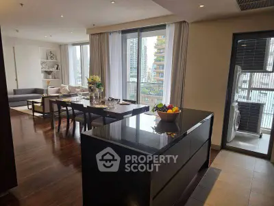 Spacious modern living room with dining area and balcony view in luxury apartment