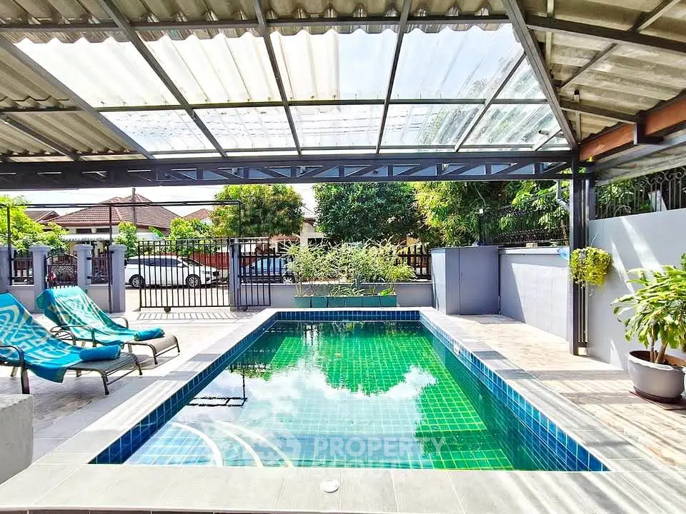 Stunning private pool area with modern design and lush greenery, perfect for relaxation and entertainment.