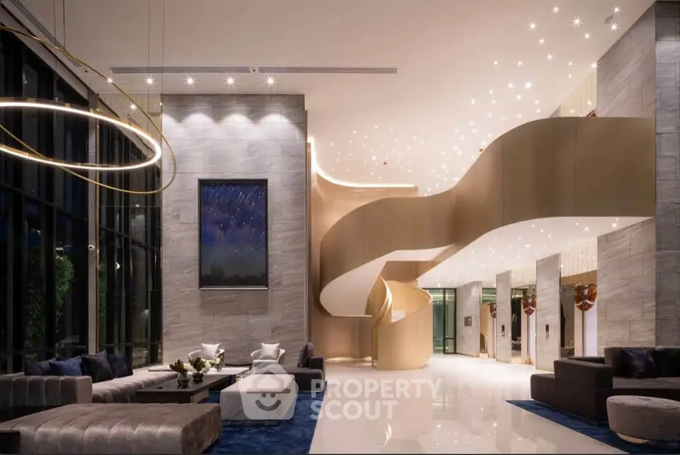 Luxurious modern lobby with elegant spiral staircase and chic seating area