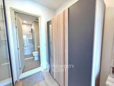 Modern bathroom with sleek design and wooden accents