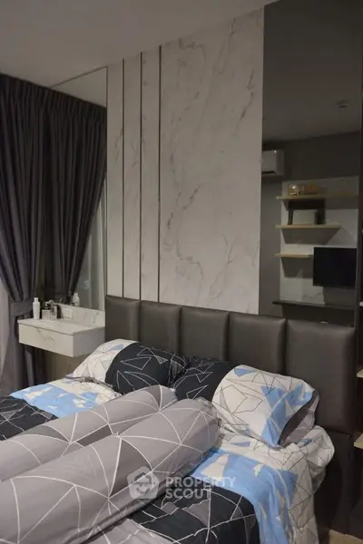 Modern bedroom with stylish decor and cozy bedding