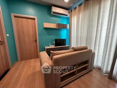 Cozy living room with modern decor and air conditioning