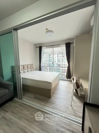 Modern bedroom with balcony view in stylish apartment