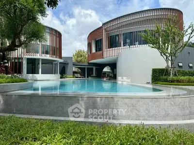 Modern architectural design with sleek pool and lush greenery