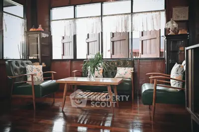 Charming vintage living room with wooden floors and classic furniture