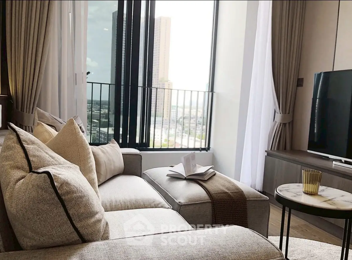 Luxurious living room with cozy sofa and stunning city view through large windows.