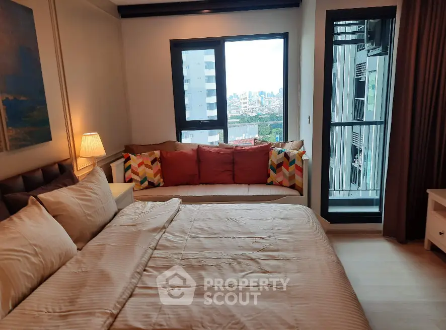 Cozy bedroom with city view and stylish decor in modern apartment
