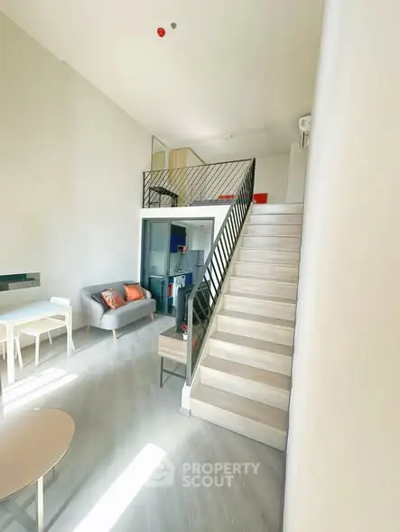 Modern loft apartment with high ceilings and stylish mezzanine level