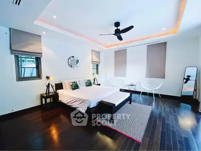 Luxurious modern bedroom with elegant decor and hardwood floors