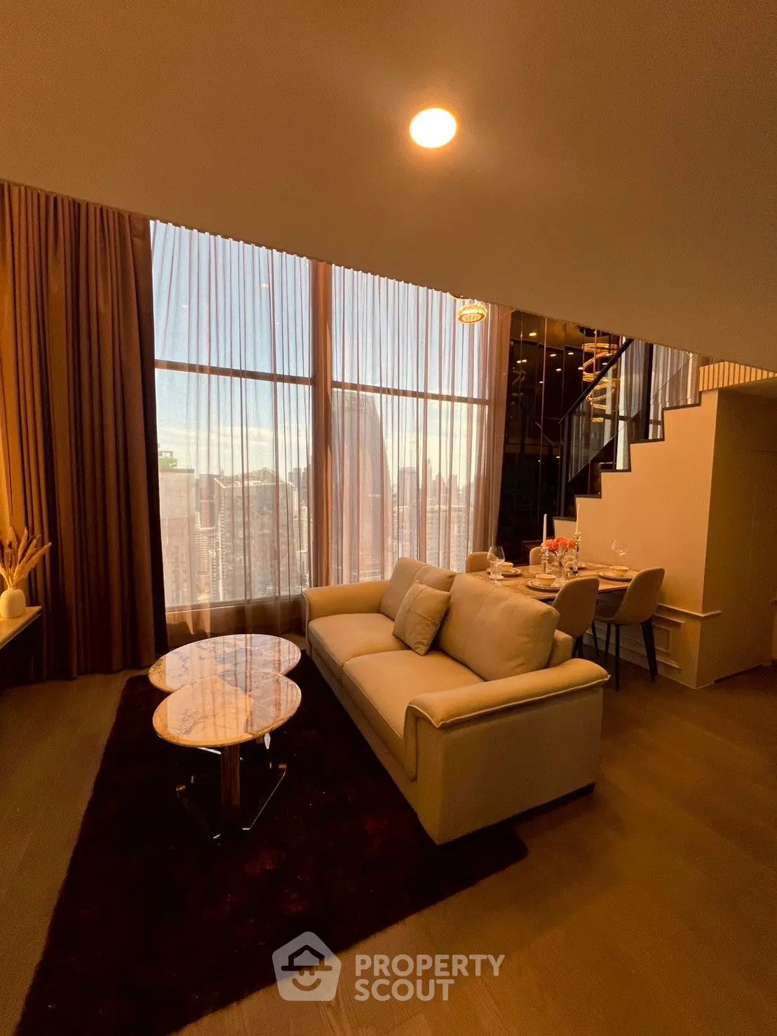 Luxurious living room with stunning city view and elegant decor