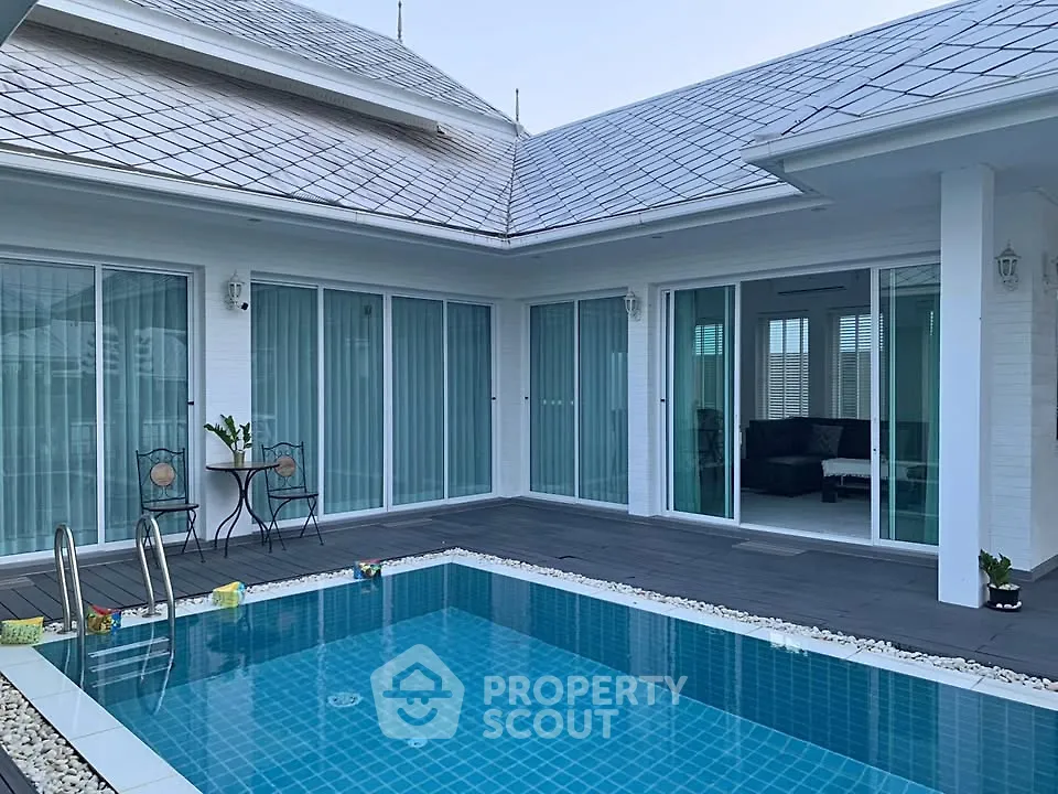 Luxurious modern home with private pool and spacious patio, perfect for relaxation and entertainment.
