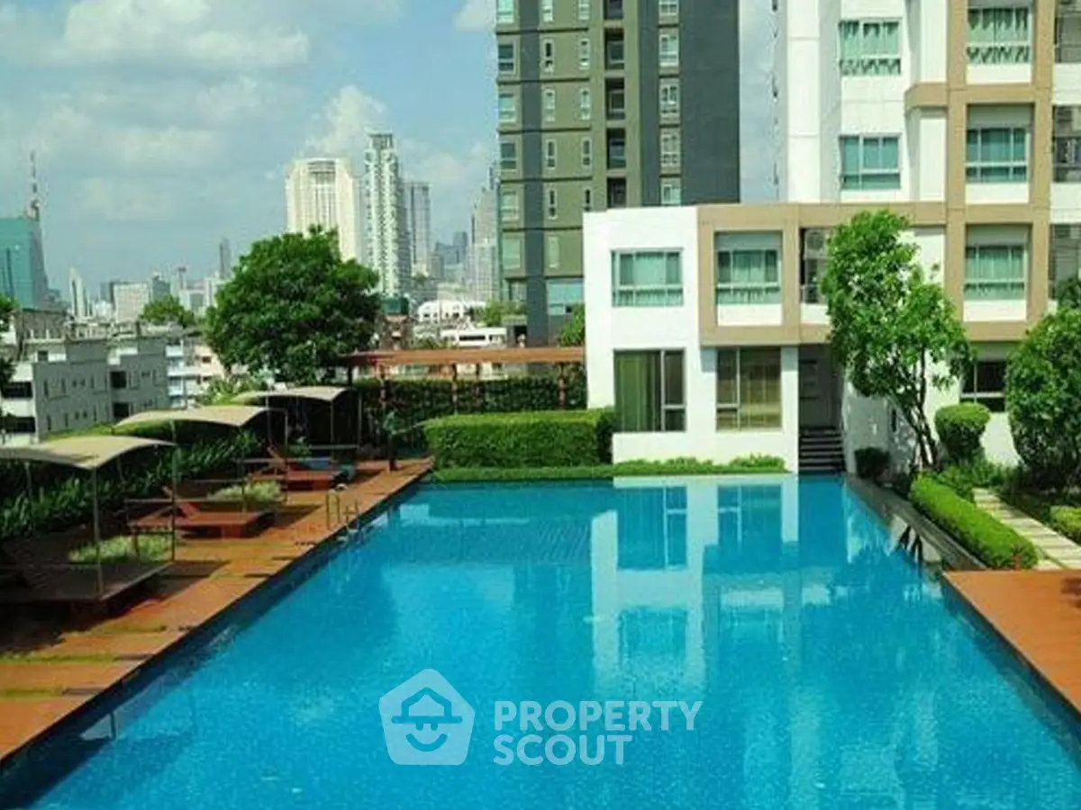 Luxurious condominium with stunning pool and city view, perfect for urban living.
