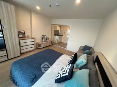 Spacious modern bedroom with stylish decor and cozy ambiance