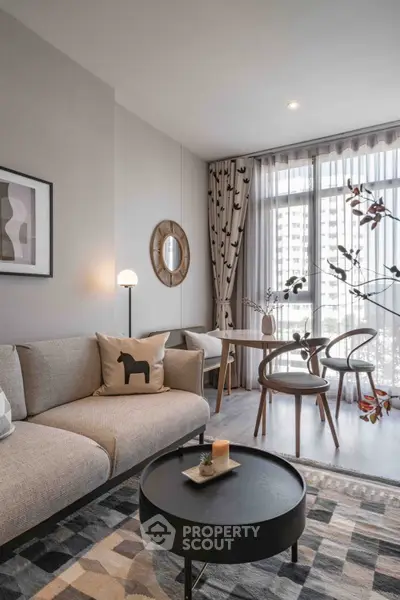 Stylish modern living room with elegant decor and large windows