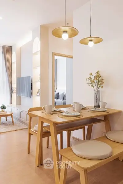 Modern dining area with wooden table and cozy seating in stylish apartment