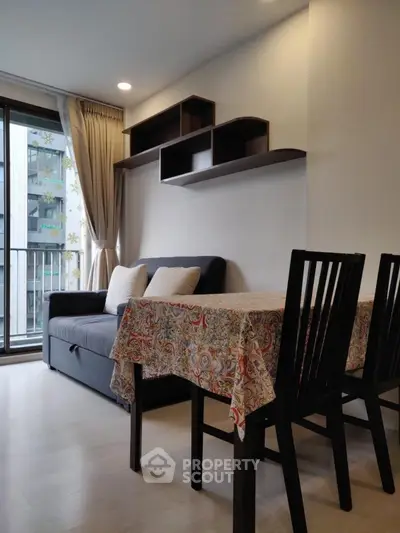 Modern living room with stylish furniture and balcony view