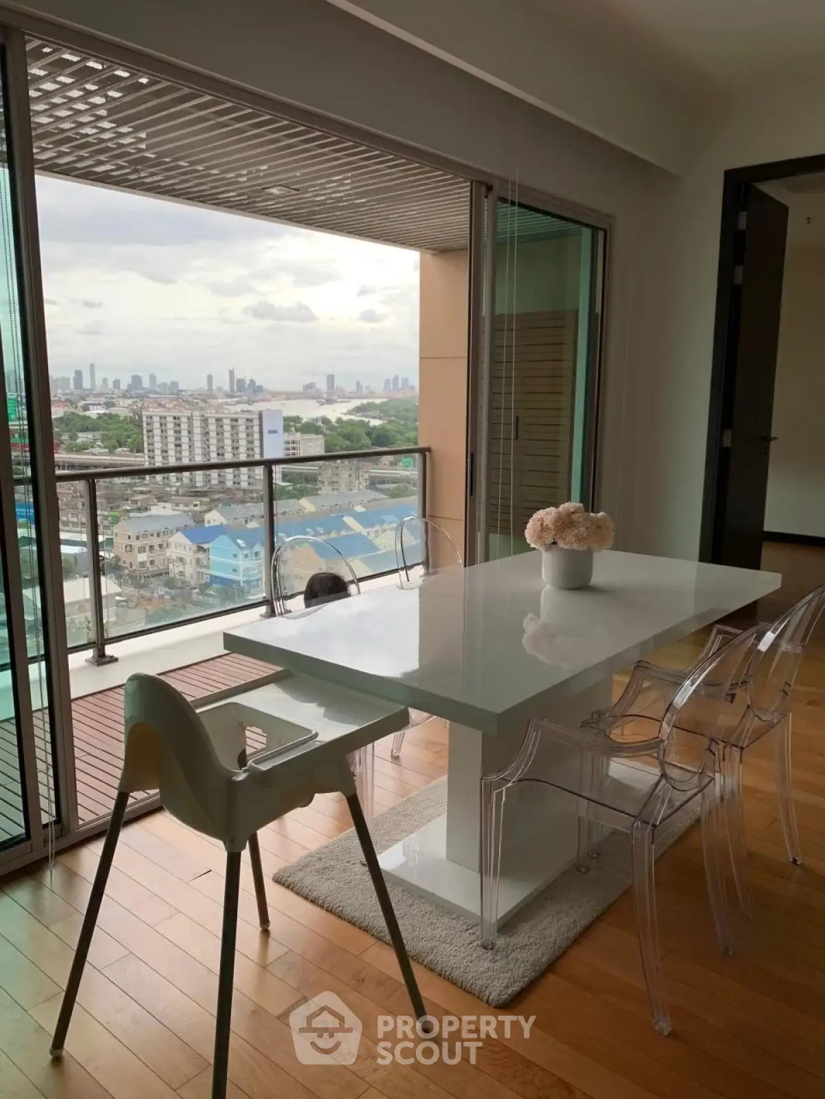 Modern dining area with stunning city view and sleek furniture