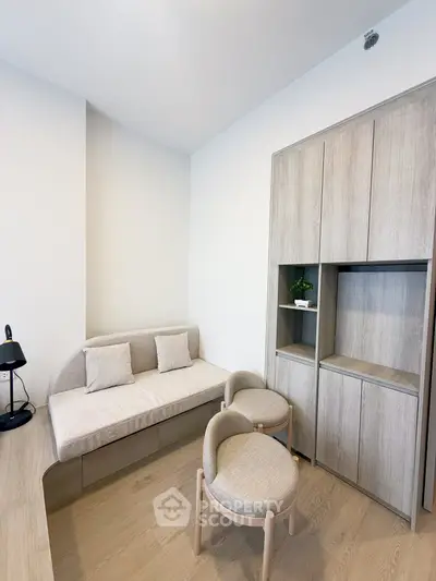Modern minimalist living room with stylish furniture and wooden flooring